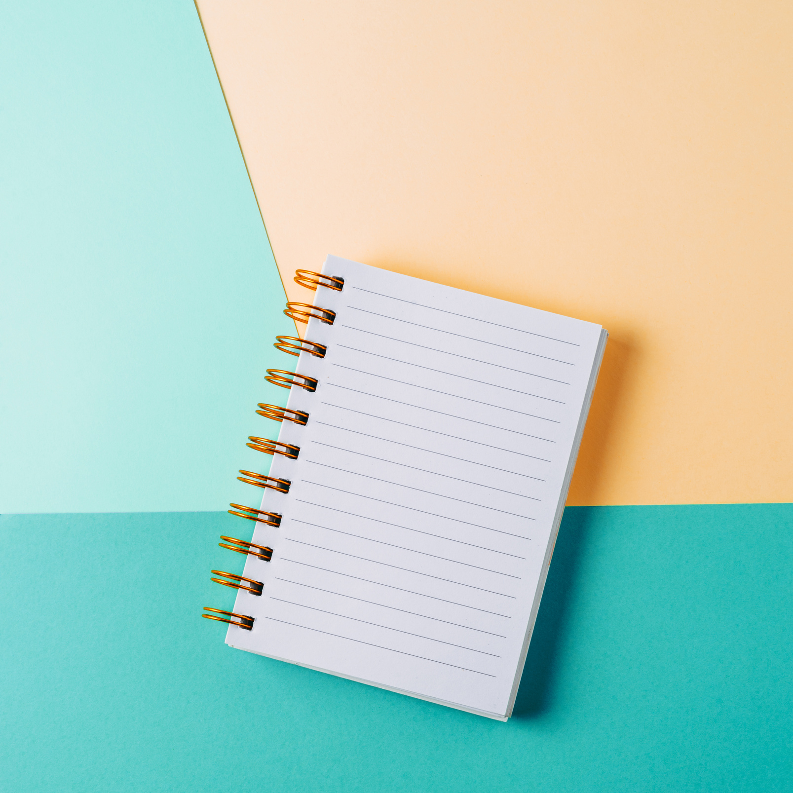 Notebook on a Colored Background